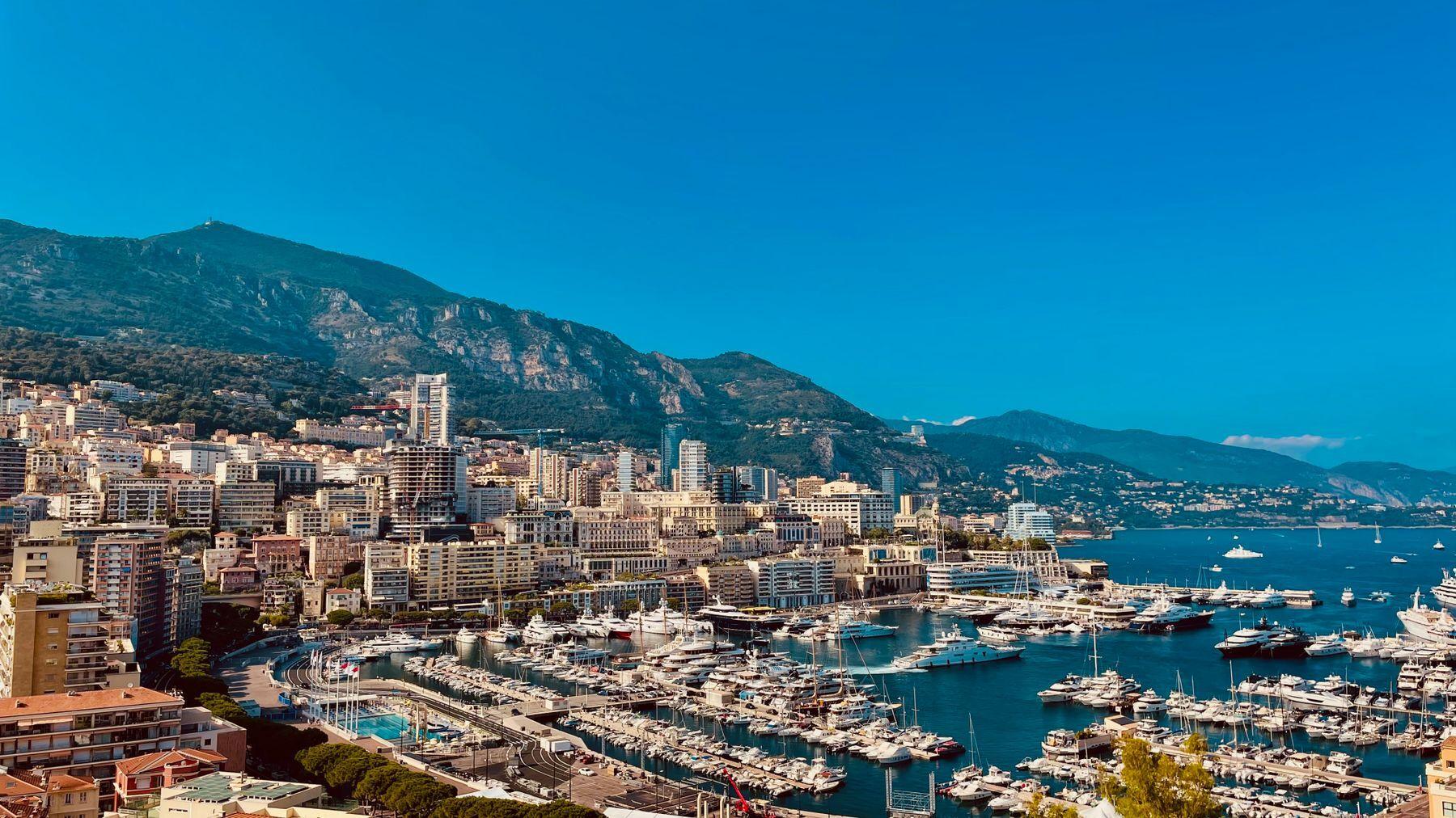 Port Hercule in Monaco, packed with yachts below Monte Carlo