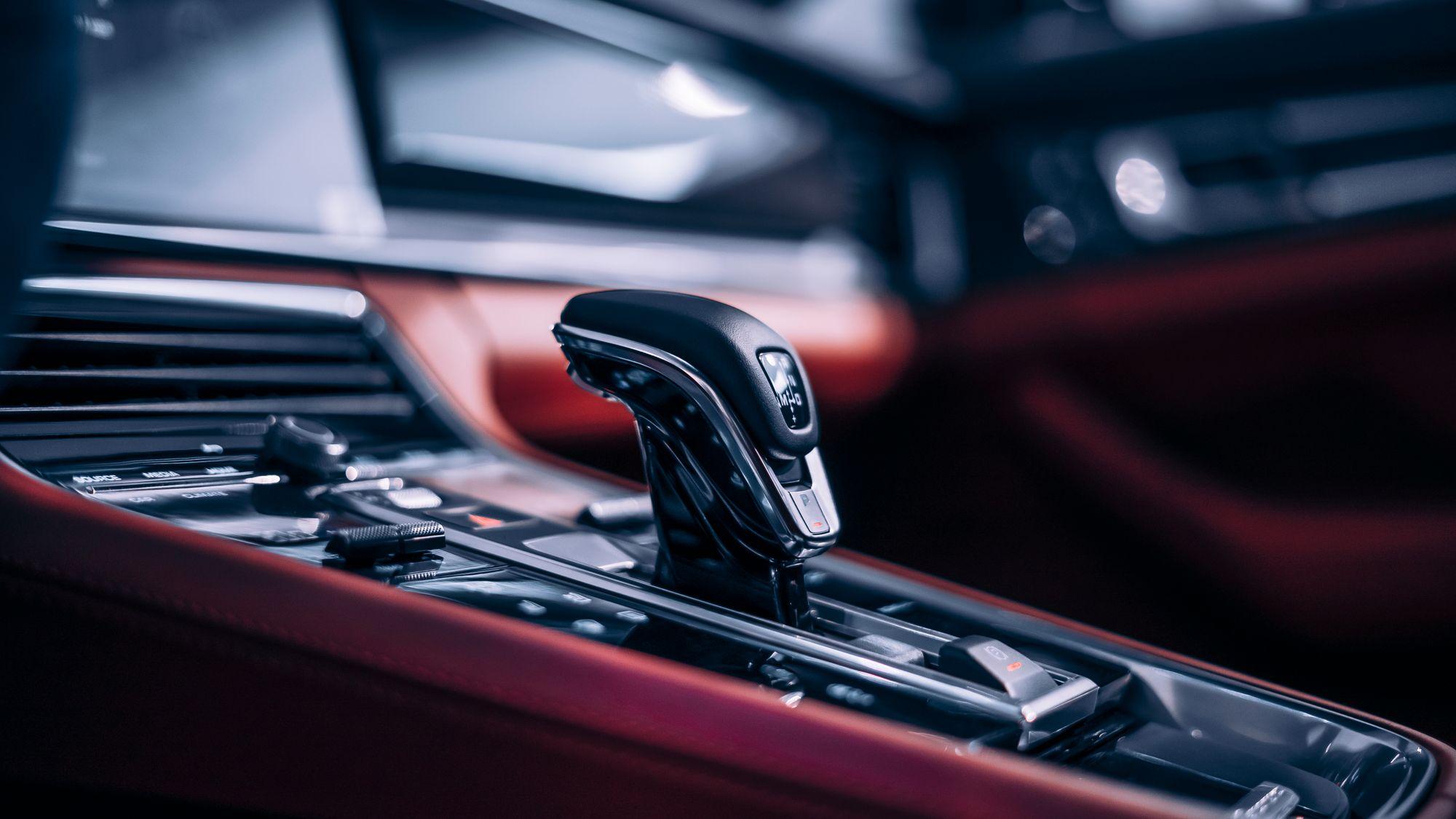 Forged-carbon console and red leather cabin